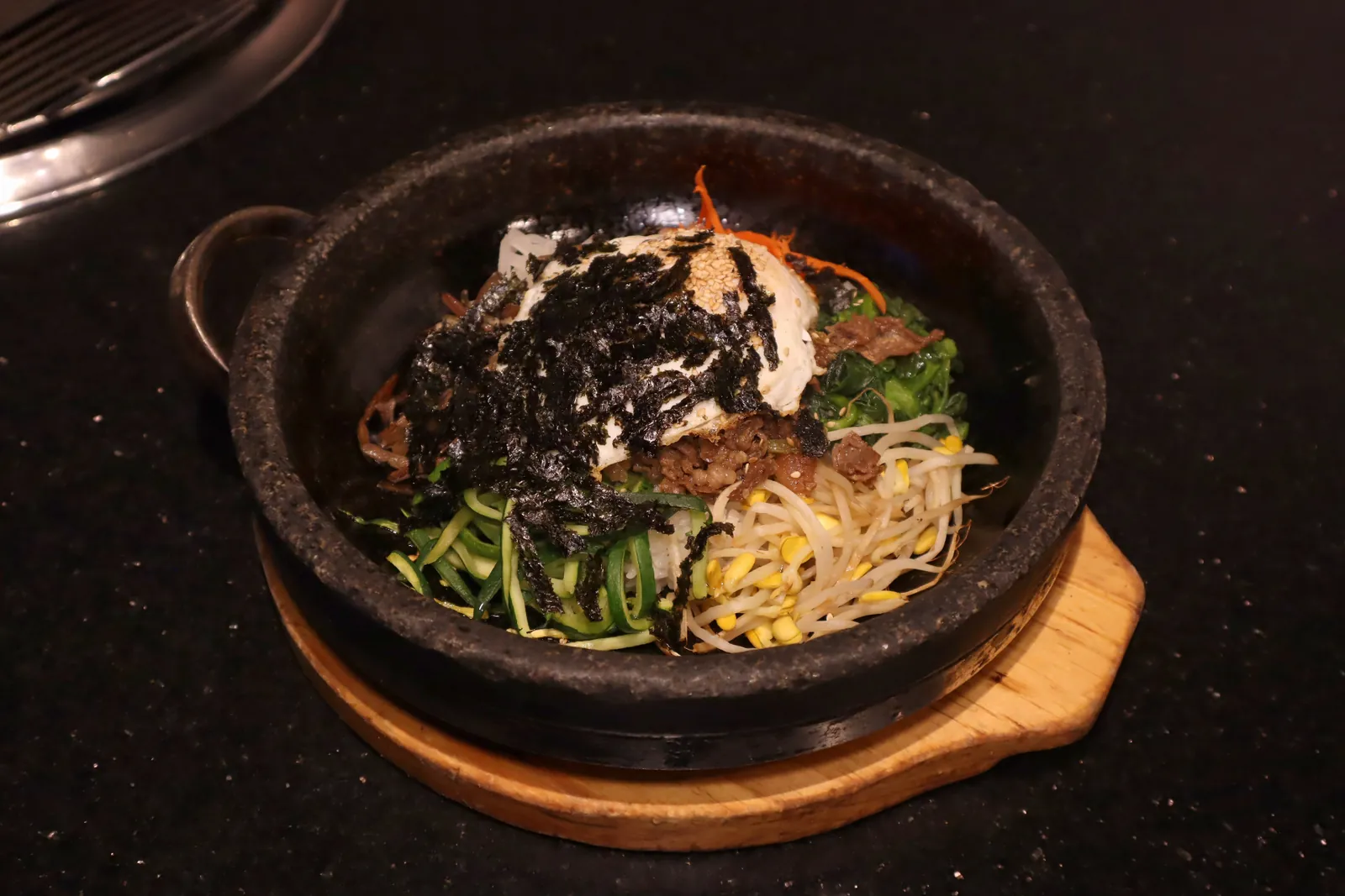 Dolsot bibimbap in a hot stone bowl